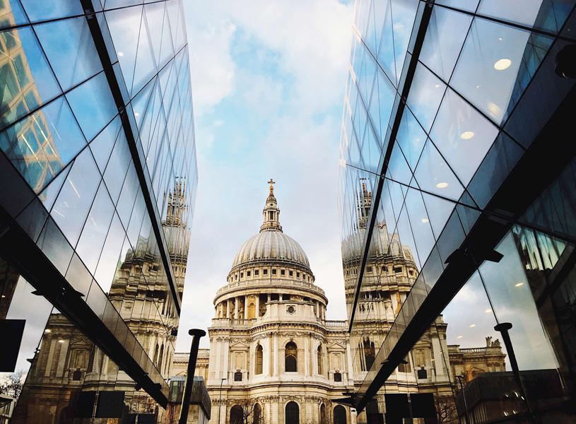 St. Paul’s Cathedral reflected in modern glass buildings in London