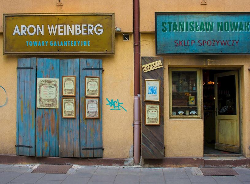 Storefronts with vintage signs and weathered wooden door