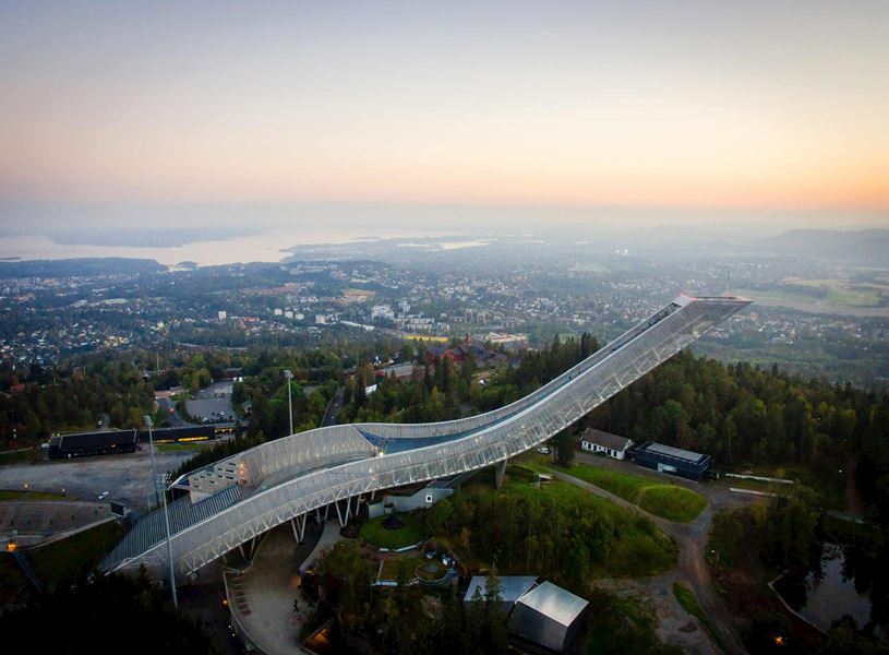 Holmenkollen Ski Jump in Oslo overlooking city and fjord at sunset