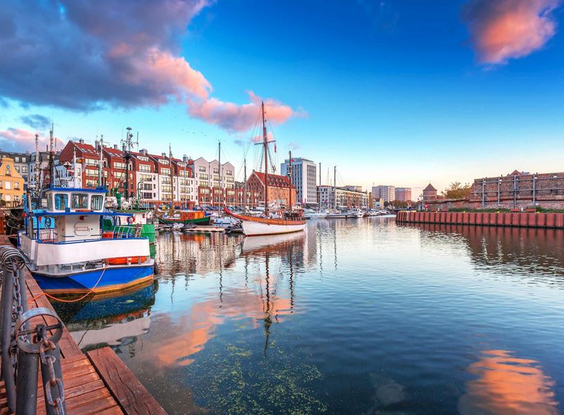 Gdańsk marina with colourful waterfront buildings and moored boats 