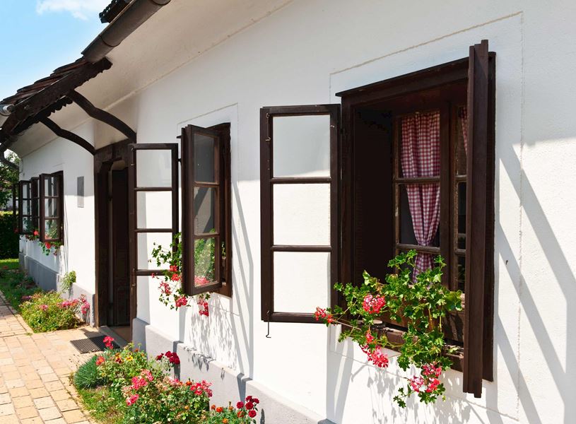 Traditional house with open windows in Kumrovec, Croatia
