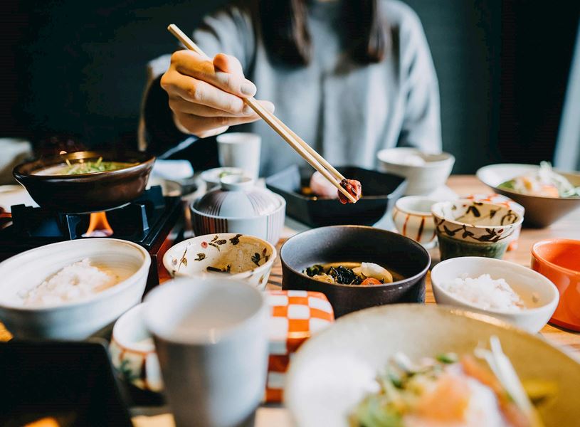 Kaiseki lunch bowls arranged at traditional Japanese ryokan near Kyoto, Japan
