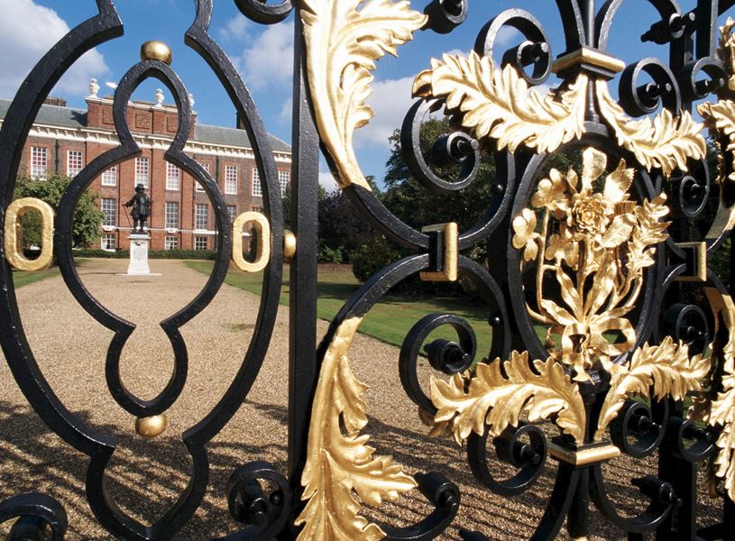 Ornate black and gold gate at Kensington Palace in London, England