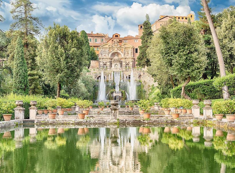 Villa d’Este in Tivoli with fountains, terraced gardens and reflective pool surrounded by greenery