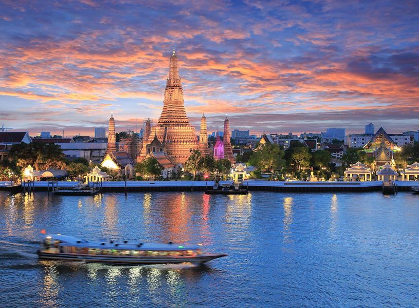 Cruise along the Chao Phraya River aboard the Loy Nava in Bangkok, Thailand