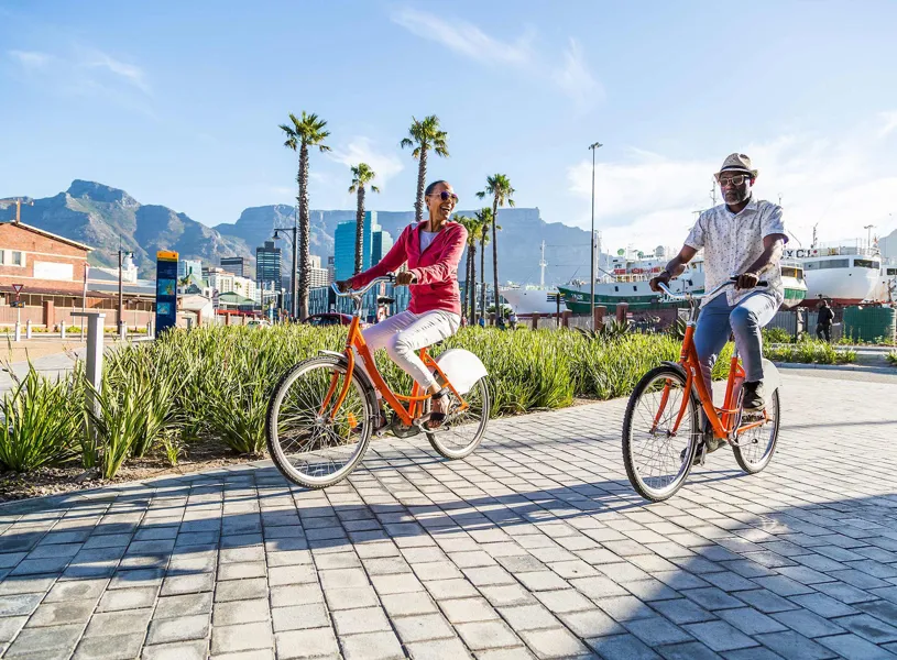 Hop on an e-bike to see the gorgeous scenery around Cape Town and enjoy a sunset for a beach braai, South Africa