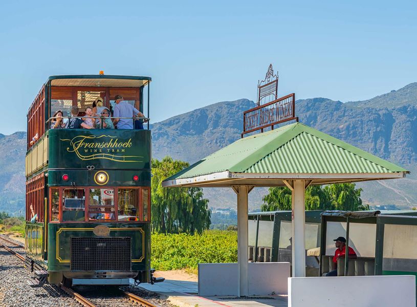 Explore wine estates onboard the vintage style Wine Tram in Franschhoek, South Africa