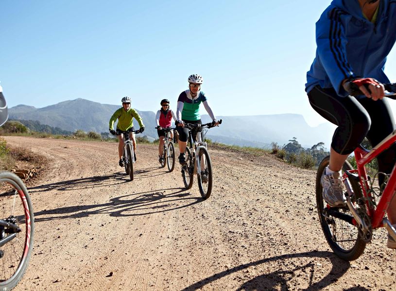 Travellers riding mountain bikes in Aberdare Country Club Estate in Nyeri, Kenya