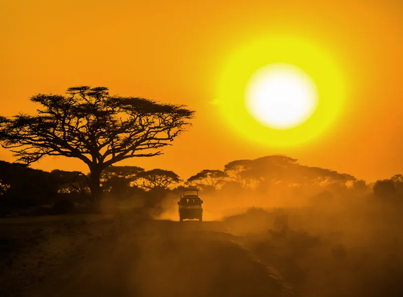 Jeep on the road at sunset in Aberdare Sanctuary, Kenya 