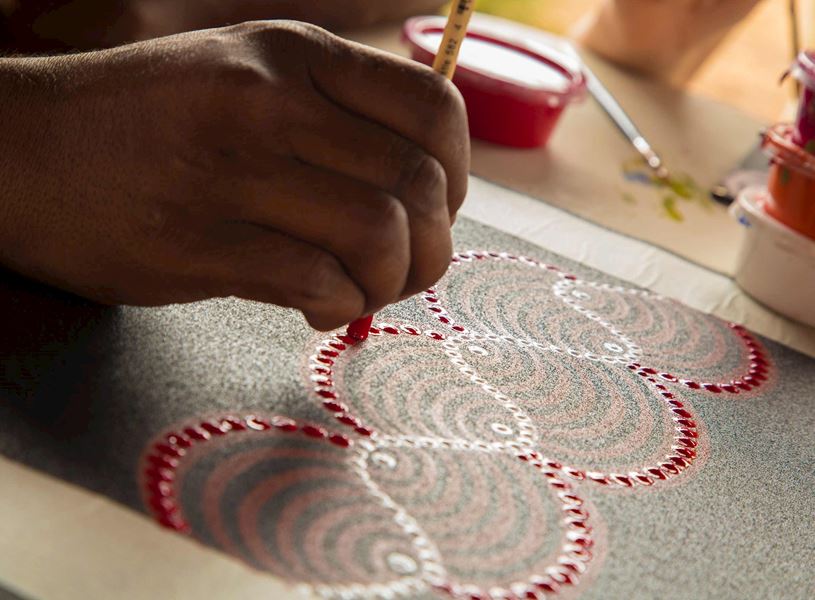 Join an Indigenous Anangu artist for an introduction to Western Desert Art in Uluru, Australia