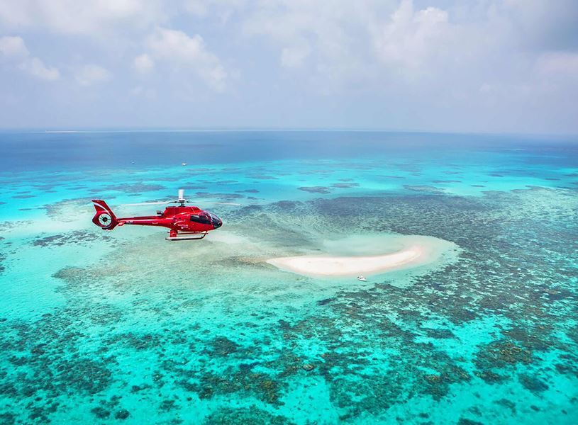 Take a 10-minute scenic flight to witness the iconic Great Barrier Reef from above in Australia