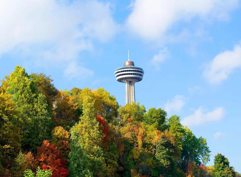 Dine by night at Skylon Tower Restaurant and discover the magic of the Niagara Falls illumination, Canada