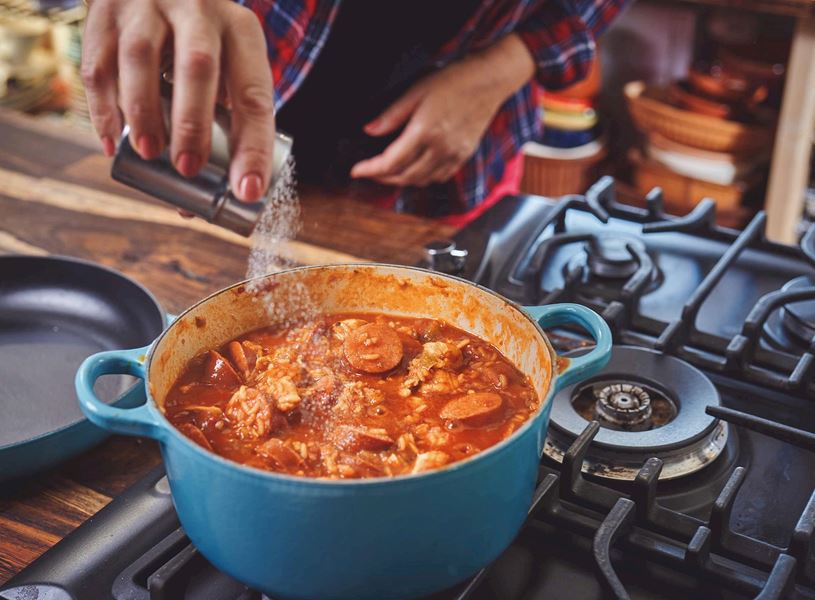 A person preparing Cajun Style Jambalaya in New Orleans, USA