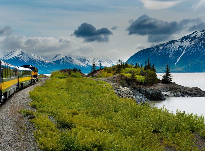 Experience the mountainous view as you ride the Alaska Railroad to Fairbanks, Alaska, USA