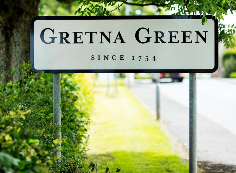 The signpost at the Scottish town of Gretna Green, Scotland