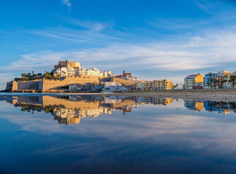 Peñíscola Castle reflected in water in Peñíscola, Spain