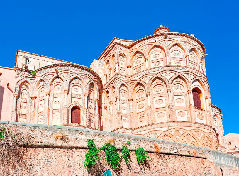 Exterior view of Cathedral of Monreale with ornate stonework in Sicily