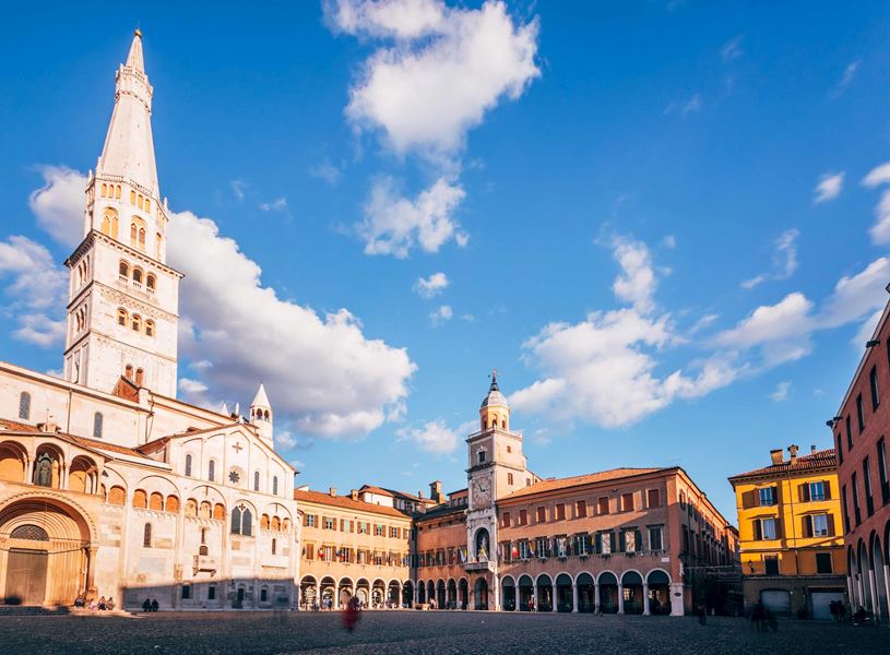 Panoramic view of Piazza Grande with Ghirlandina Tower and historic buildings in Modena