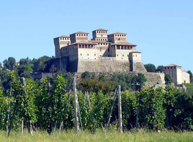 Medieval Torrechiara Castle in Parma surrounded by vineyards