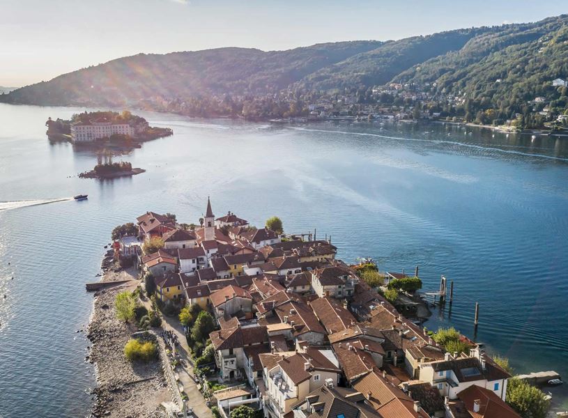 Aerial view of Isola dei Pescatori on Lake Maggiore with mountains