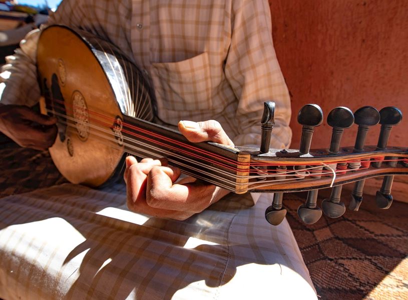 Bedouin man playing an Oud in Petra, Jordan