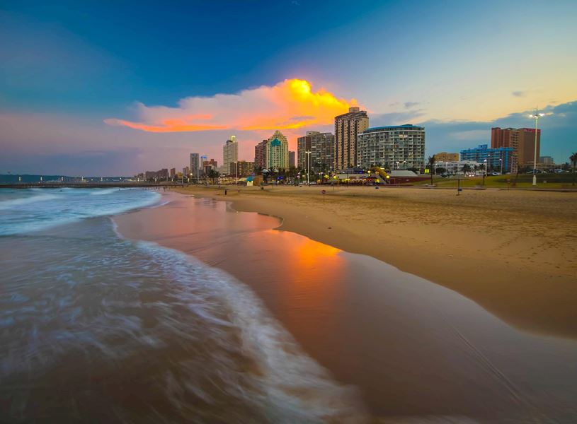 Durban cityscape and coastline under colourful sky, South Africa