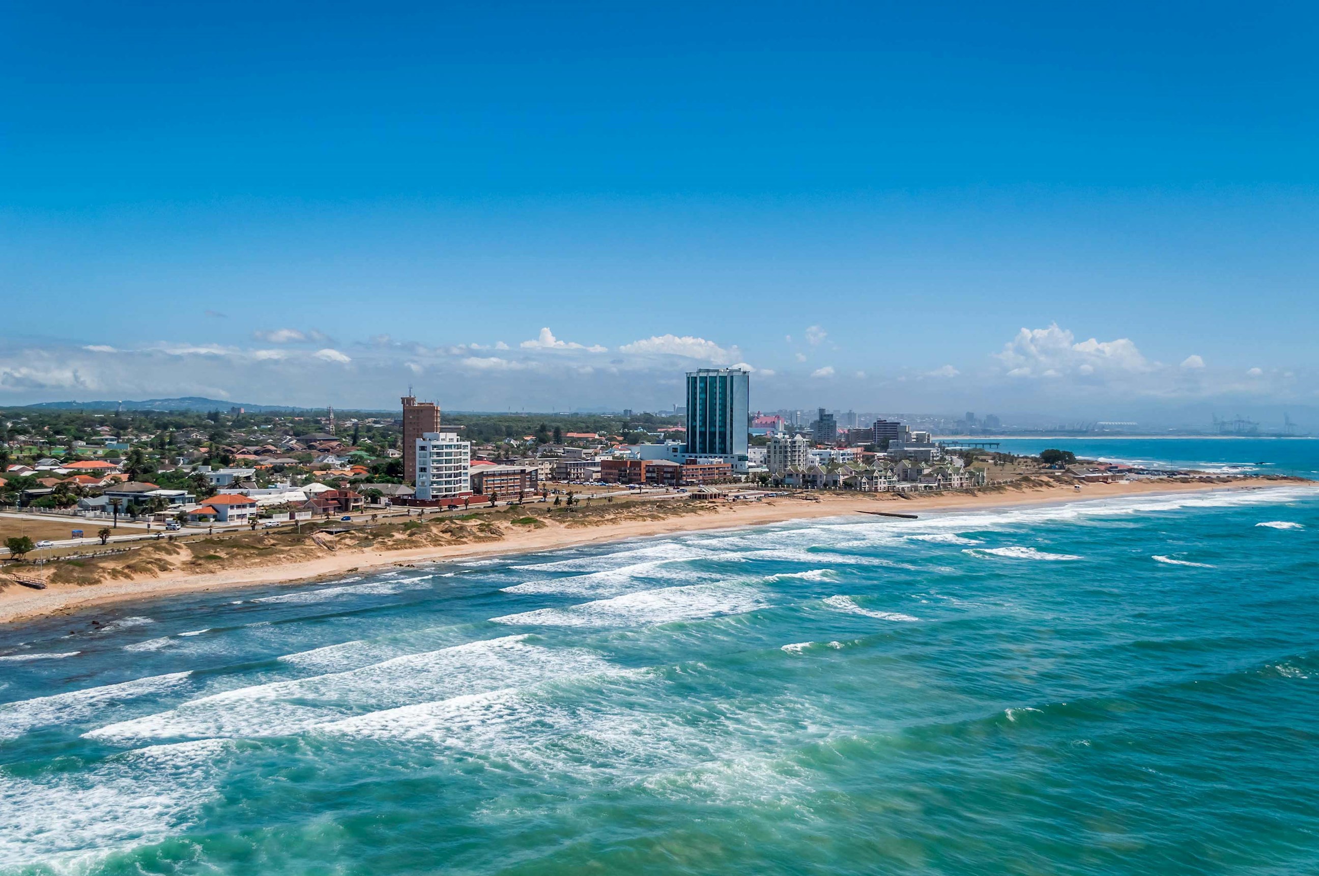Gqeberha skyline overlooking turquoise waters under blue sky, South Africa