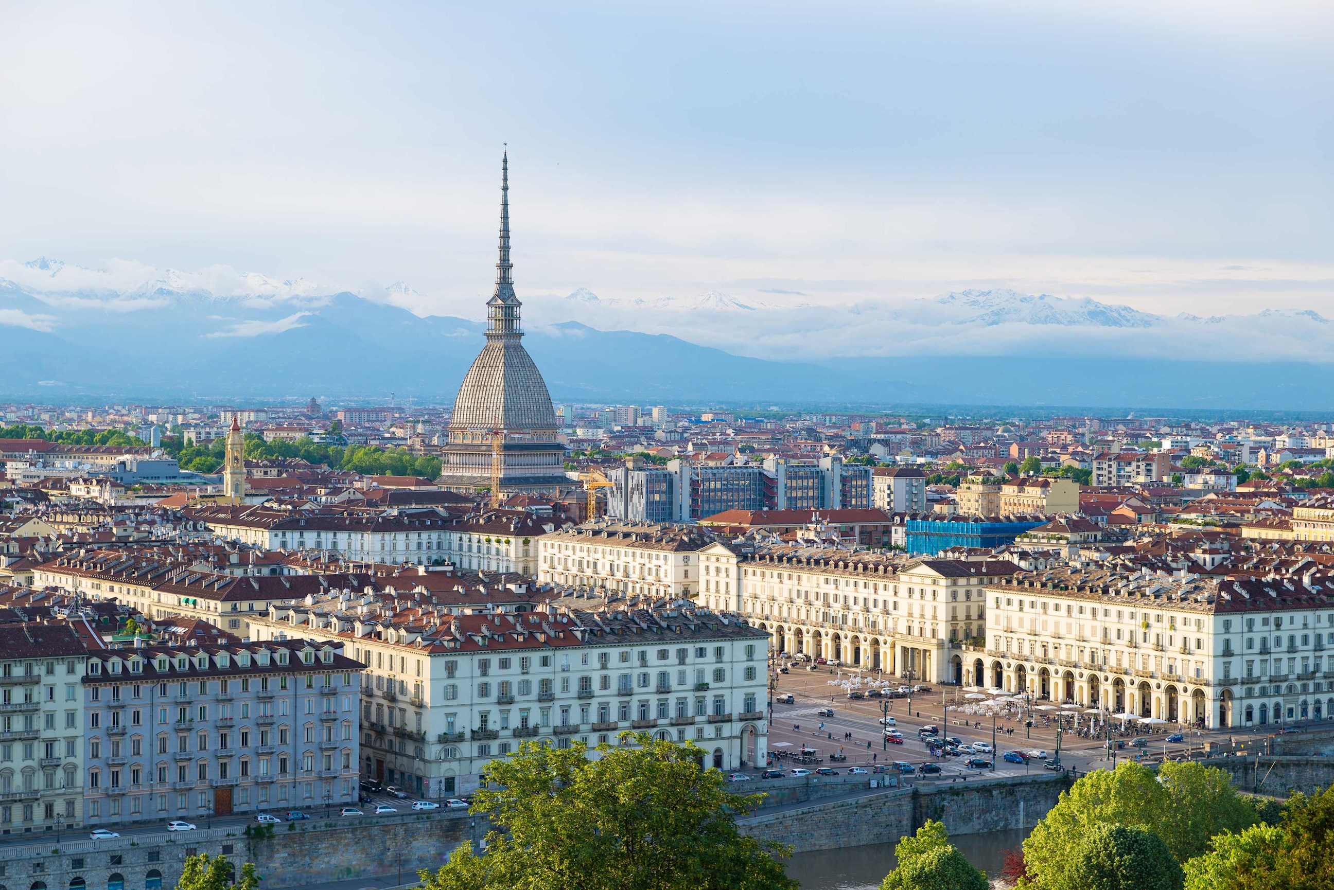 Panoramic view of Turin city with Mole Antonelliana and snow-capped Alps in background