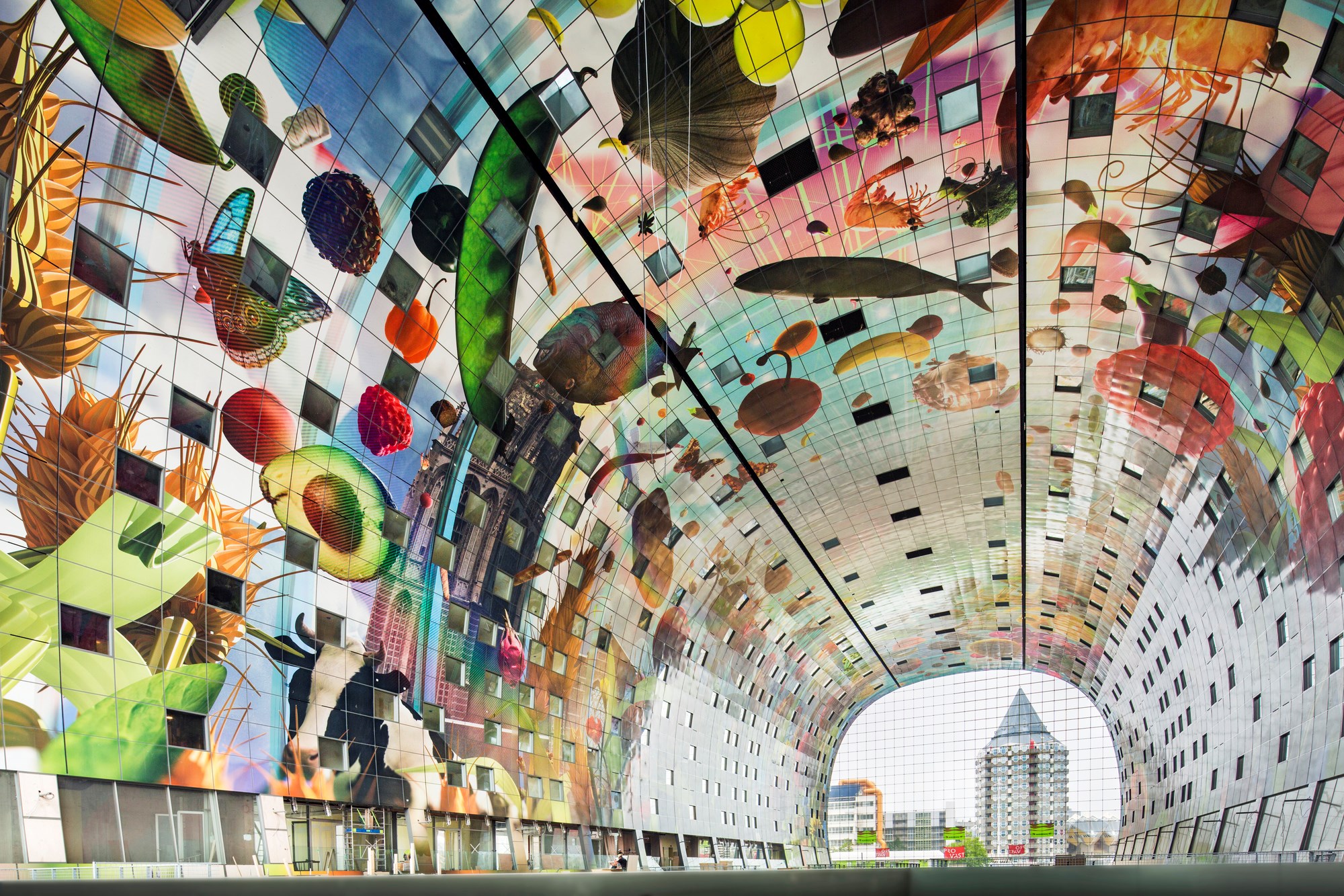 Colourful ceiling artwork inside Rotterdam Markthal food market