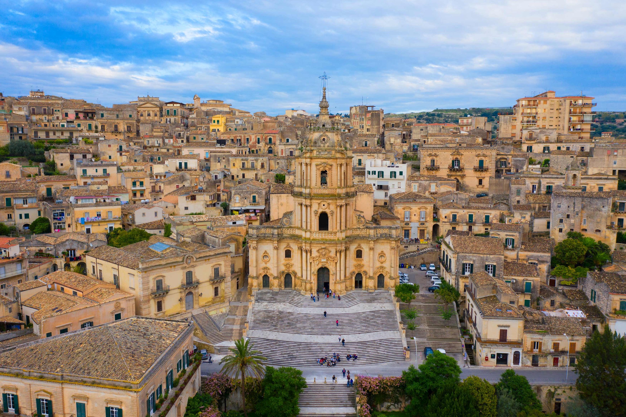 Aerial view of Modica with Baroque Cathedral of San Giorgio and historic houses