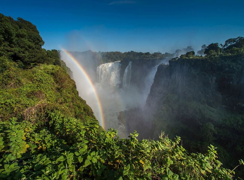 Victoria Falls showing double rainbow above Devil’s Cataract in Zimbabwe