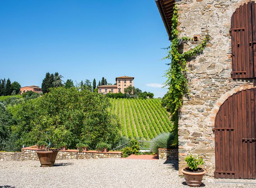 Villa Machiavelli with wooden shutters and vineyard view in Tuscany 
