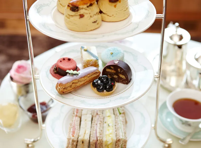 Three Tier Afternoon Tea Stand with Finger Sandwiches, pastries and scones 