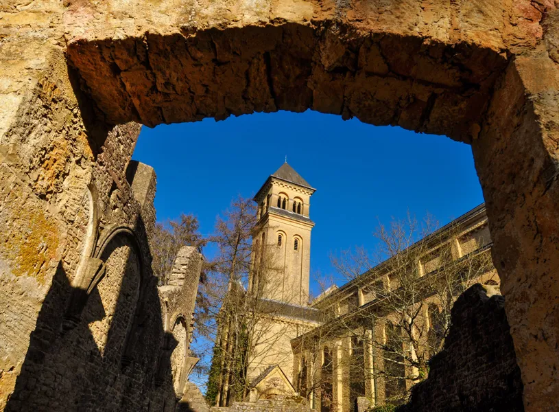 Abbey of Orval Bell tower through archway in Florenville, Belgium