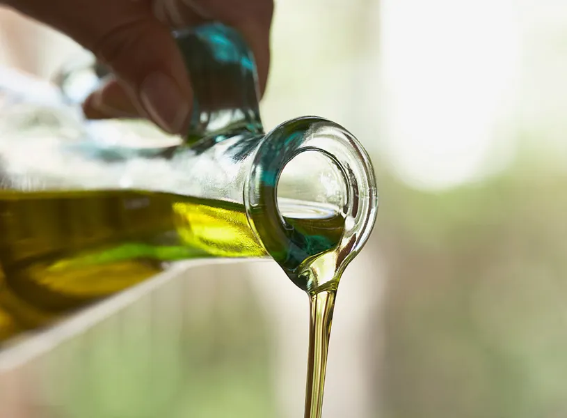 Olive oil being poured into a bowl, Torremolinos, Spain