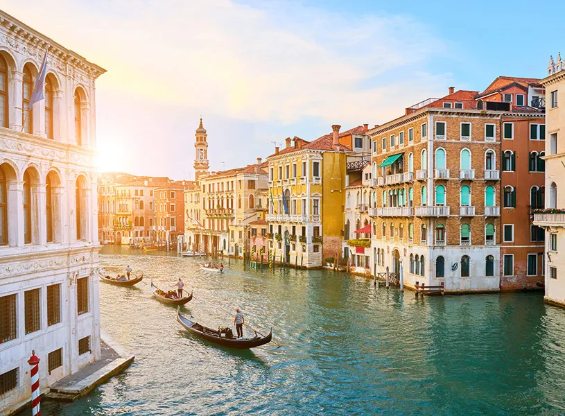 Gondaliers at Sunset in Venice, Italy