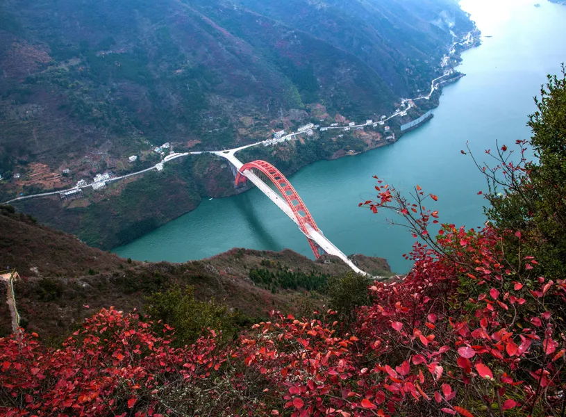 Scenic view of red bridge and fall foliage on Yangtze River, China