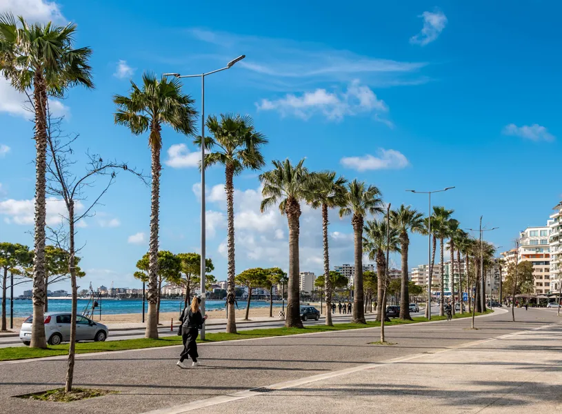 Traveller walking on the seafront in Vlorë, Albania