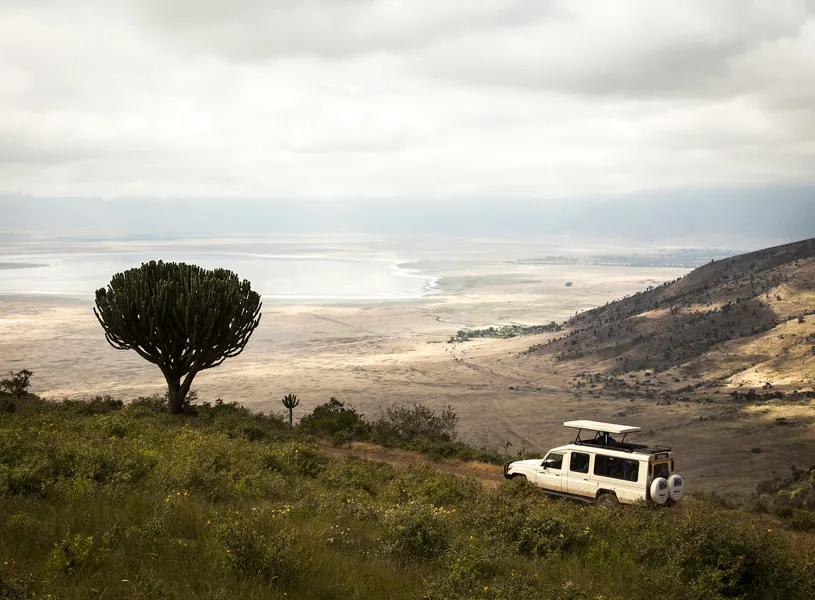 Safari vehicle driving on the edge of the Ngorongoro Crater, Tanzania