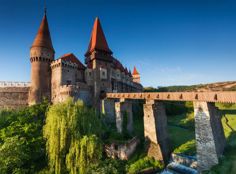 Corvin Castle in Hunedoara and stone bridge over moat in Hunedoara, Romania