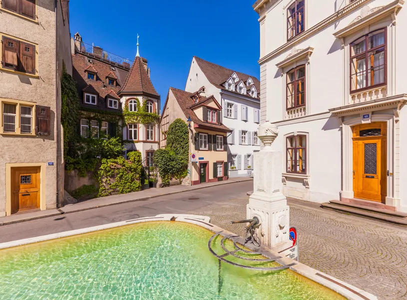 Street in Basel Old Town St. Alban-Vorstadt with fountain and buildings