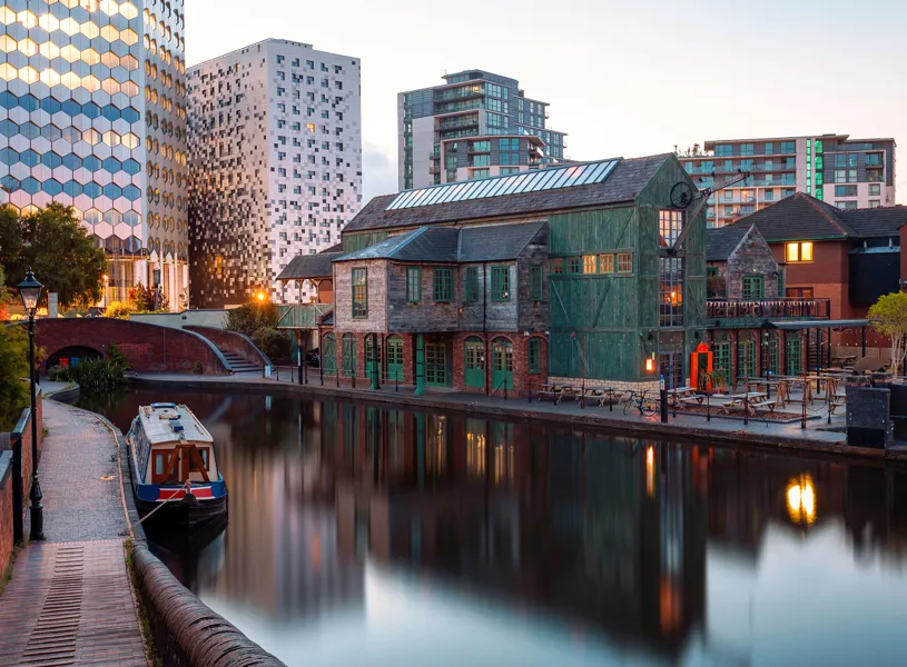 Gas Street Basin with narrow boat and buildings in Birmingham, England