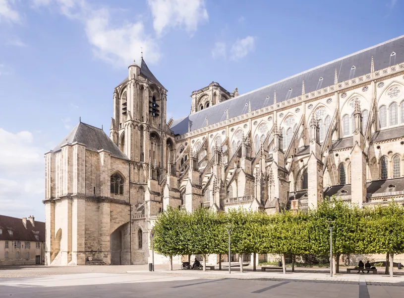 Bourges Cathedral Gothic facade with bell tower and plaza trees