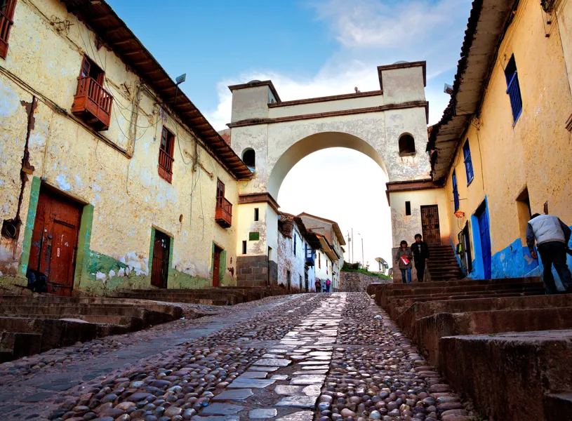White arch in historic Cusco, Peru