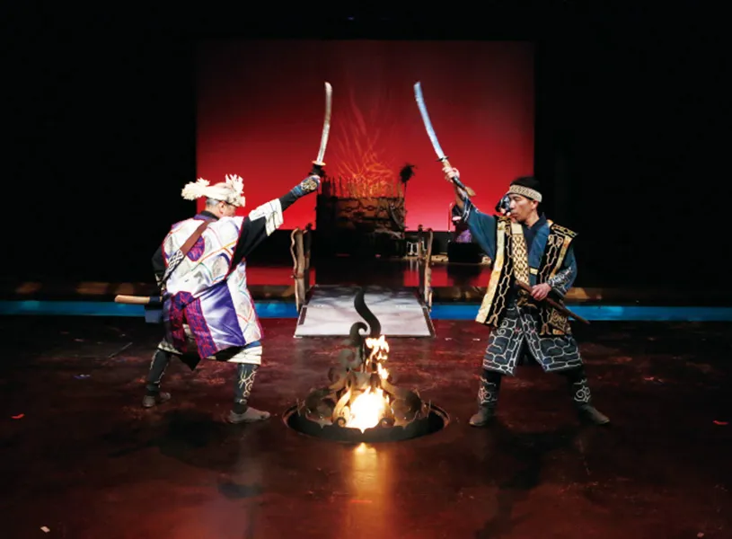 Ainu dance performance with swords near fire, Kushiro, Hokkaido, Japan