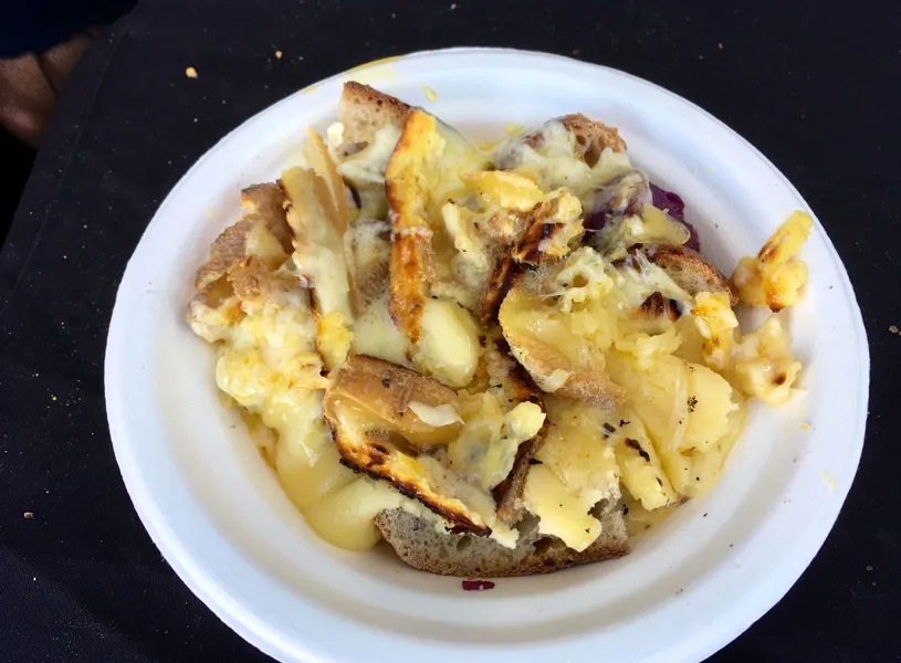 Melted Raclette Cheese on Bowl of Bread, Zermatt, Switzerland