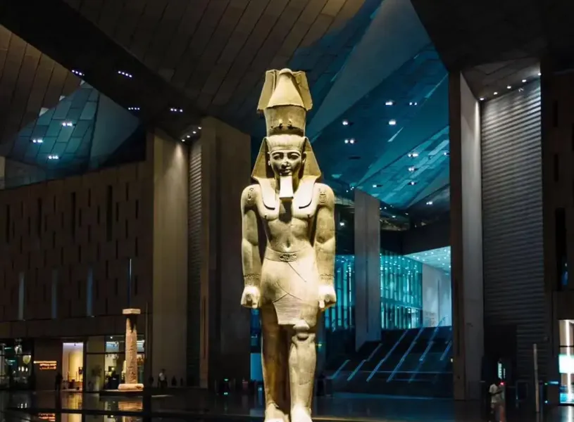Colossal Ramses II statue inside the Grand Egyptian Museum’s main hall in Cairo, Egypt
