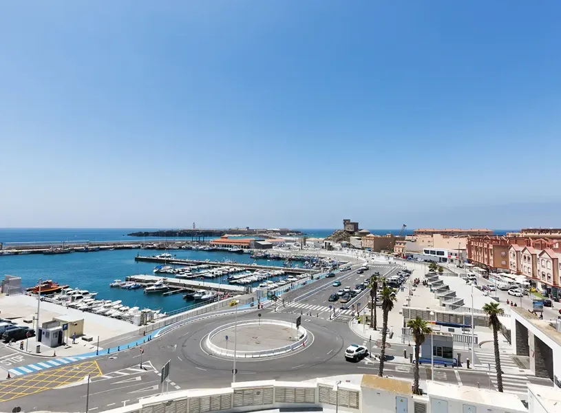 Aerial view of Tarifa Port marina with boats and roundabout