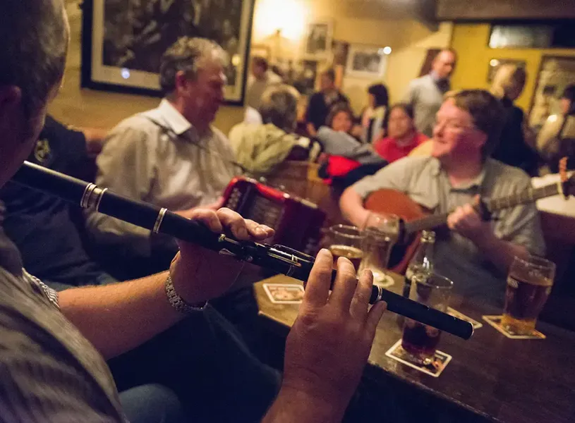 People performing in an Irish Backroom Session in Dingle, Ireland 