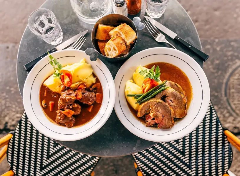 Two plates of food on a cafe table